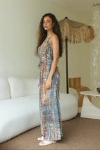 Side view of blue Bali tie-dye jumpsuit with relaxed flowing silhouette - Tulalara