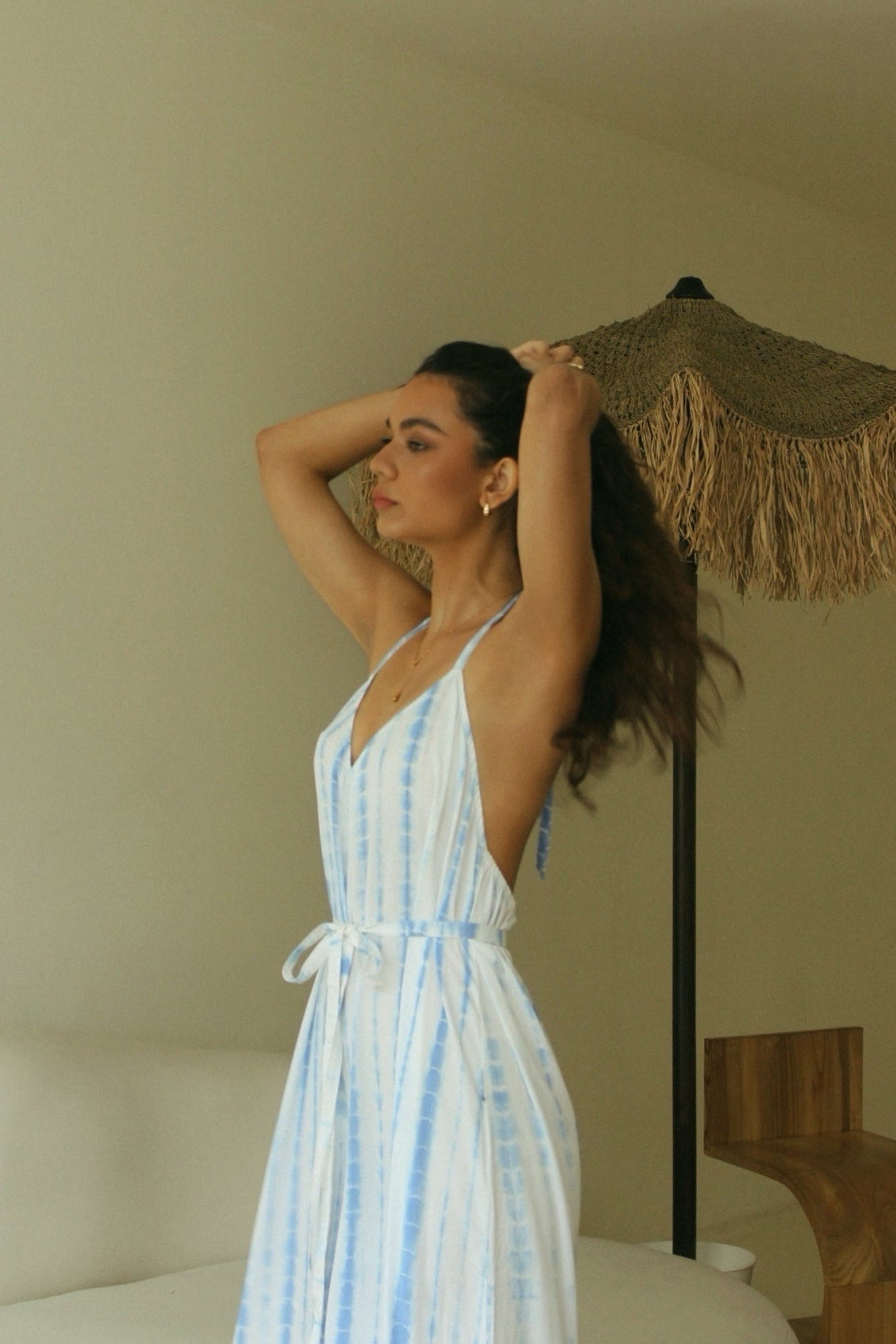 Light blue Bali tie-dye halter jumpsuit with open back detail and adjustable waist tie - Tulalara
