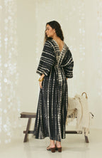 Back view of black Bali tie-dye maxi kaftan dress with open back detail - Tulalara