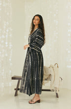 Side view of black Bali tie-dye maxi resort wear dress in relaxed silhouette - Tulalara