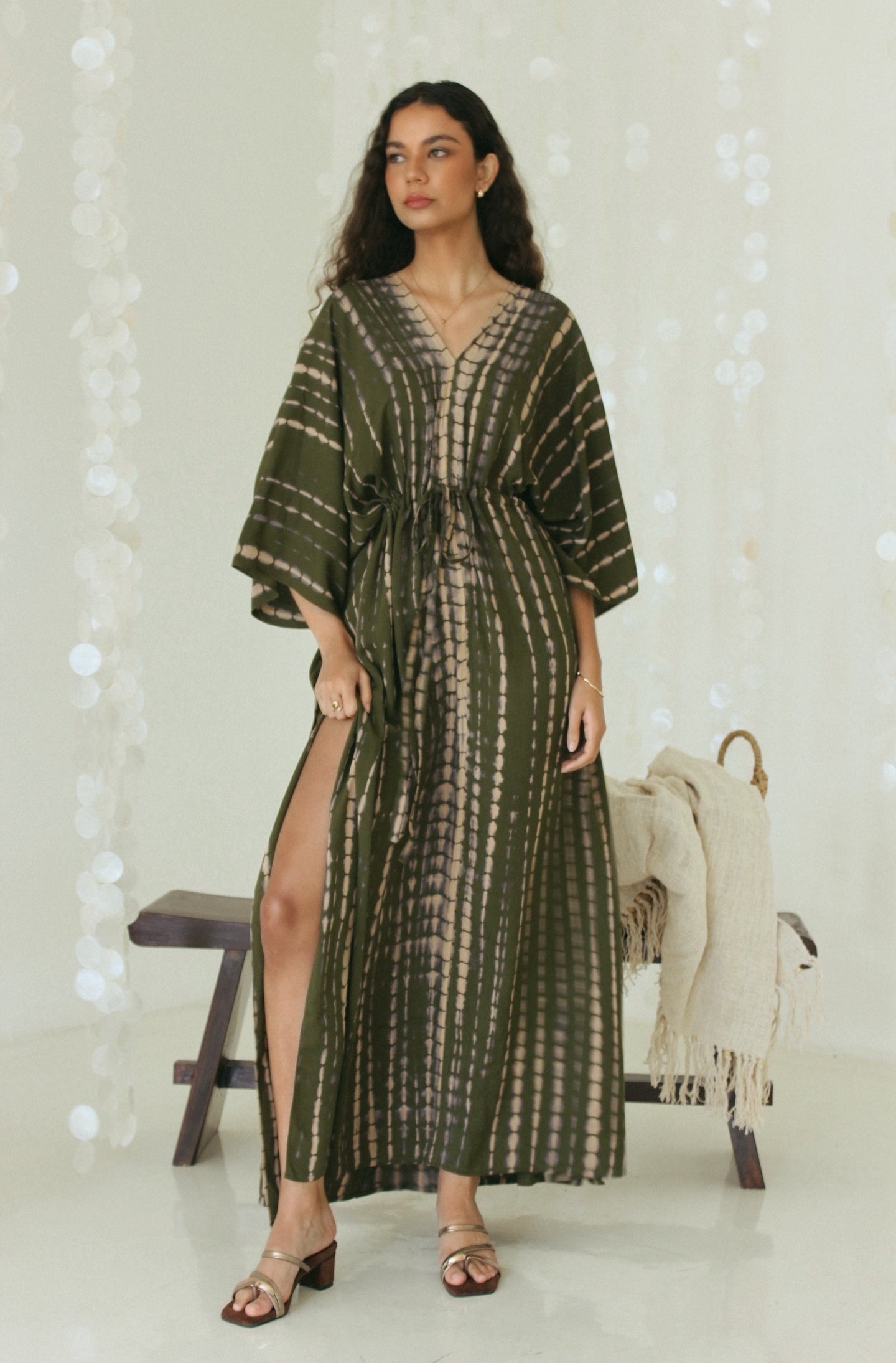 Olive Green Kaftan with adjustable drawstring waist, flowing maxi silhouette and sultry slit – Tulalara