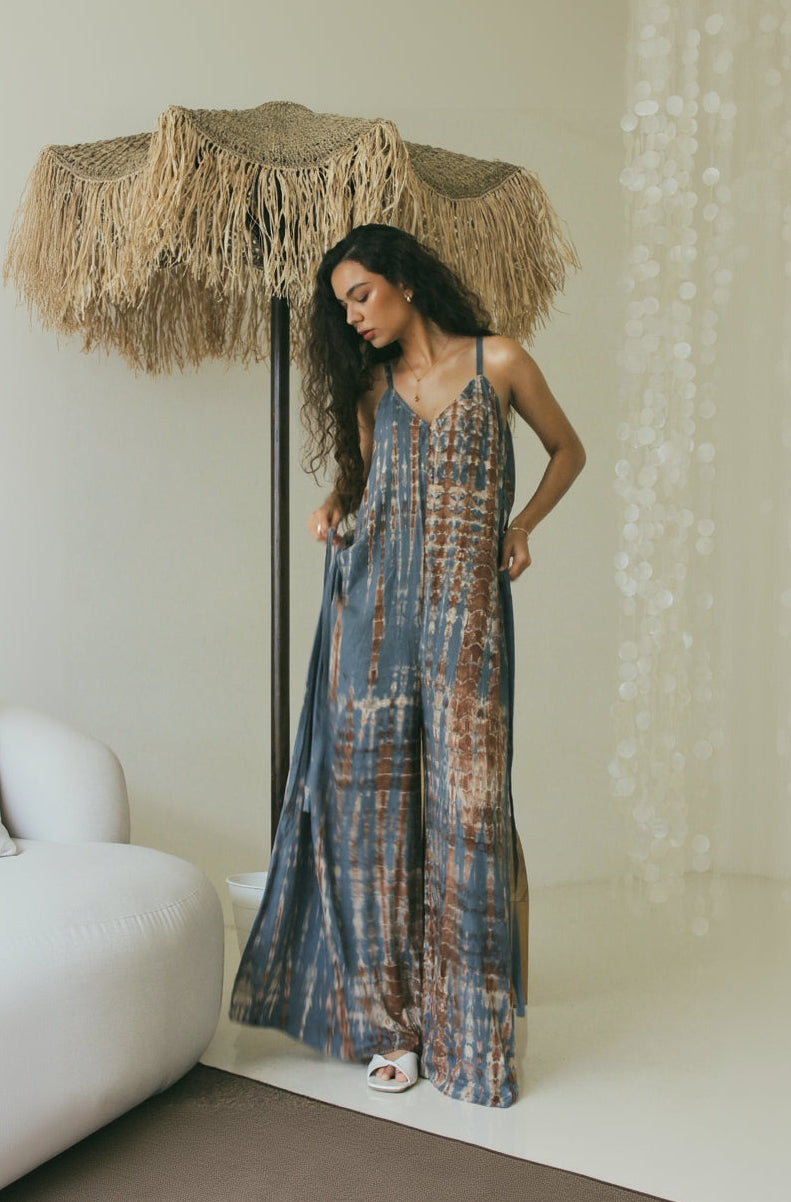 Women’s flowing resort wear Bali tie-dye wide leg jumpsuit with adjustable side ties - Tulalara