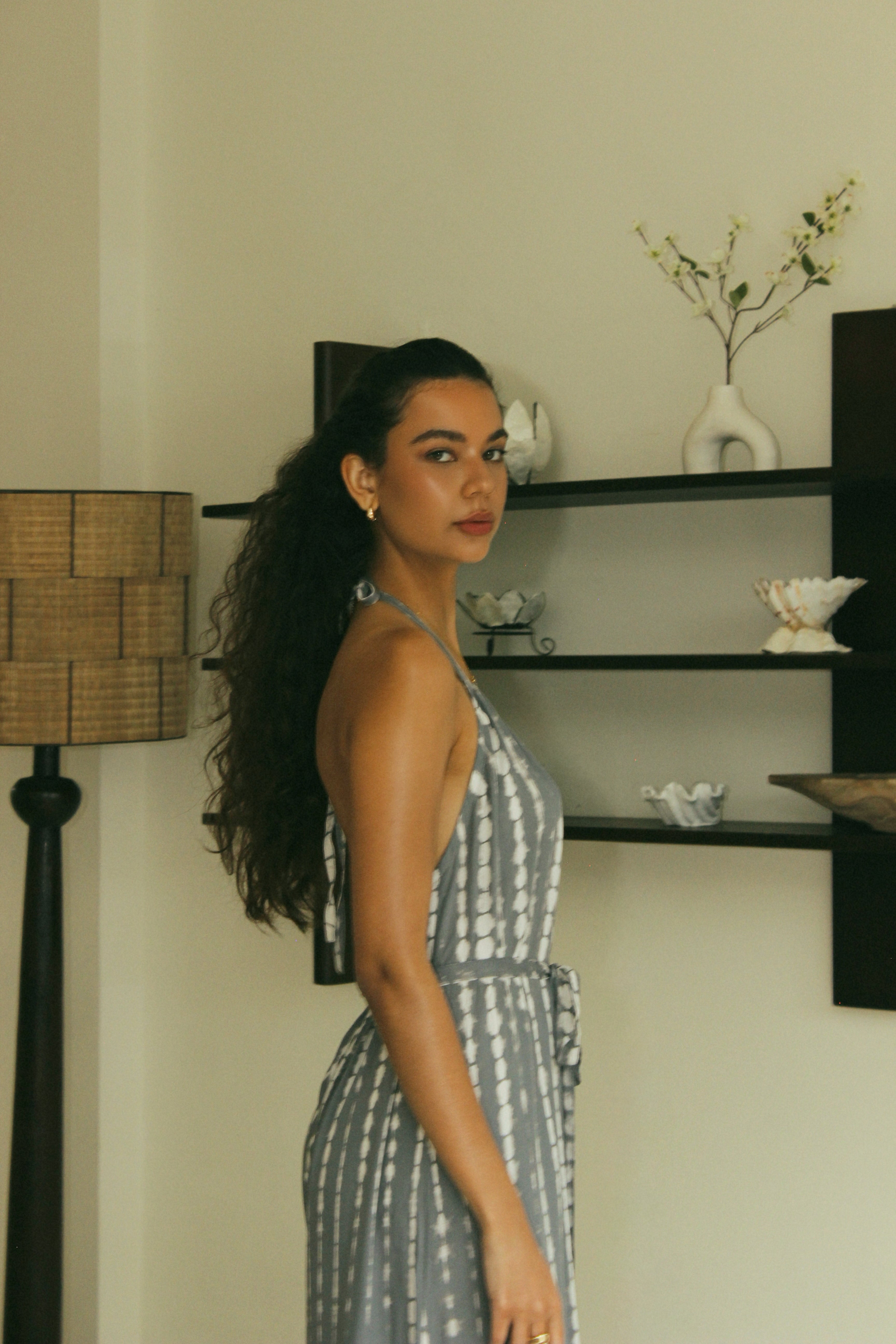 Elegant open-back resort wear jumpsuit in soft grey Bali tie-dye tones - Tulalara