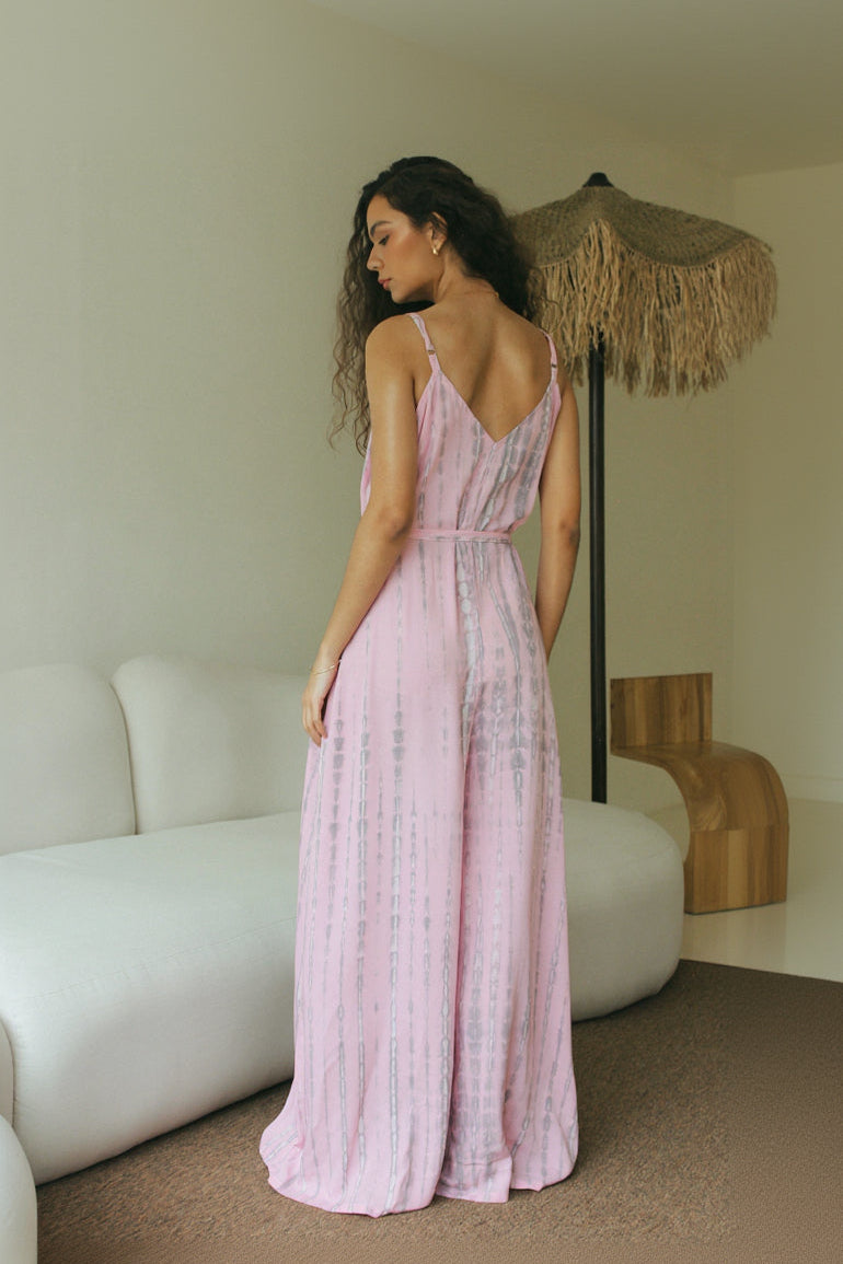Back view of women’s pink tie-dye resort wear jumpsuit with adjustable waist tie - Tulalara
