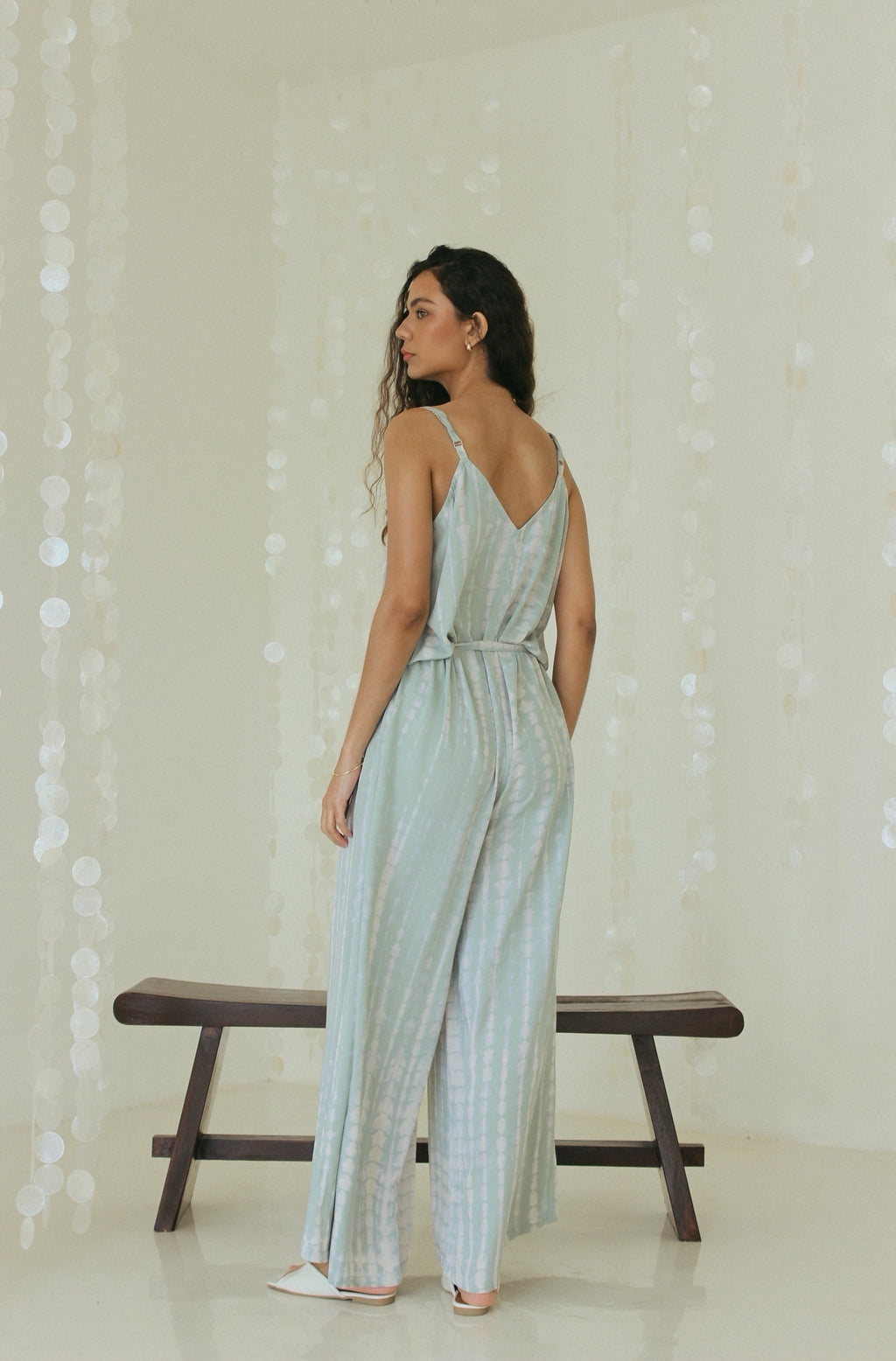 Back view of elegant Bali tie-dye beach jumpsuit with relaxed drape - Tulalara