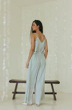 Back view of elegant Bali tie-dye beach jumpsuit with relaxed drape - Tulalara