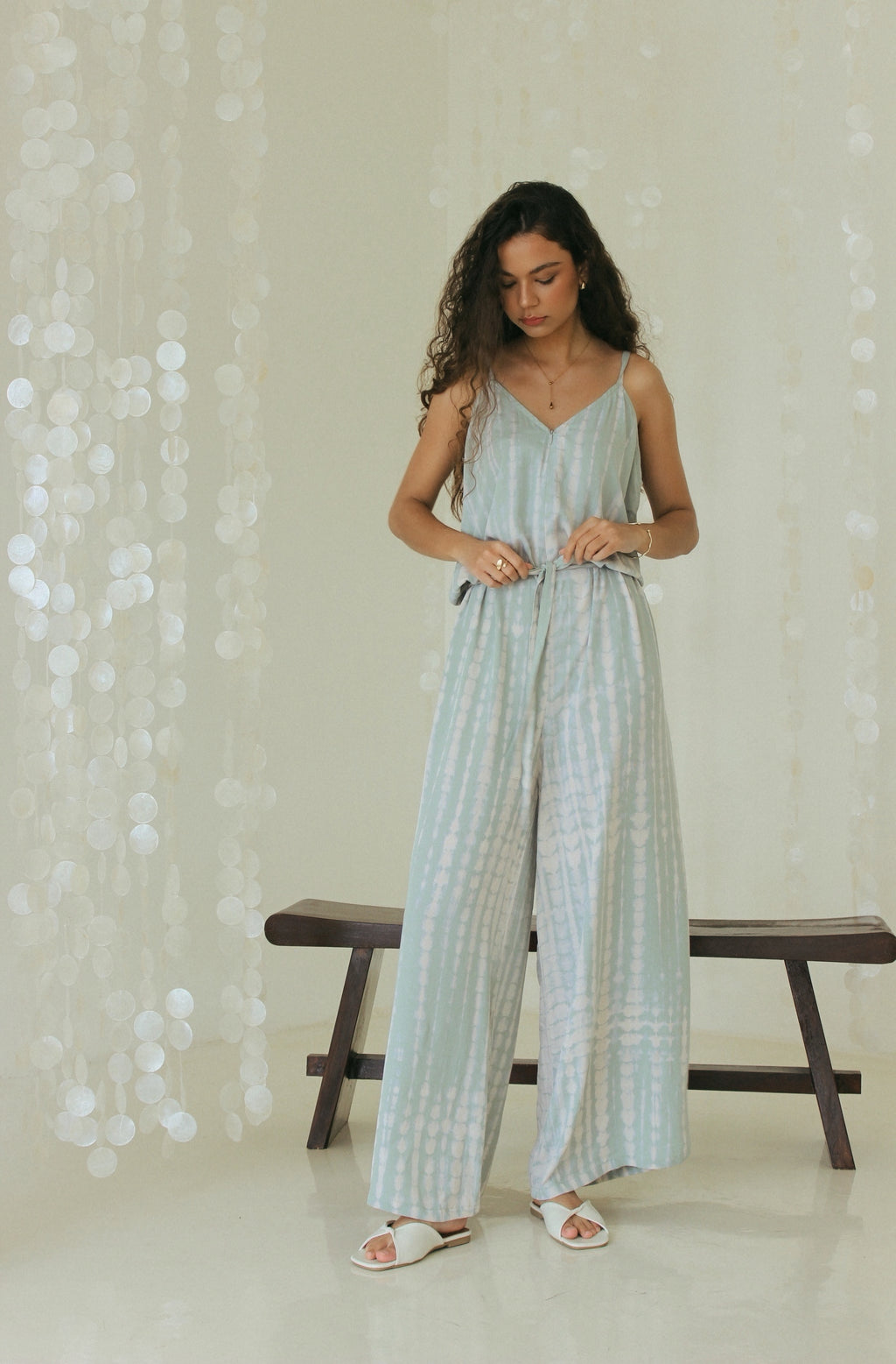 Handmade pastel green Bali tie-dye resort wear jumpsuit with adjustable side tie - Tulalara