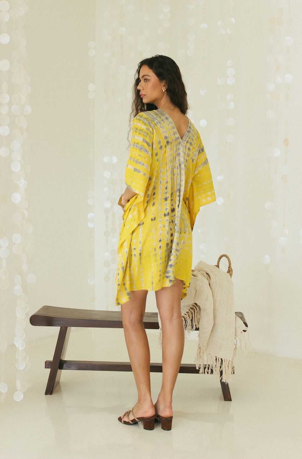 Back view of mini yellow Bali tie-dye in relaxed silhouette - Tulalara