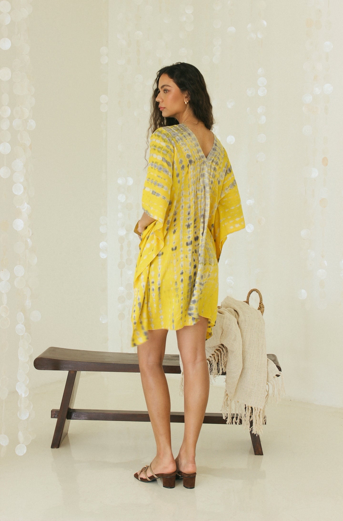 Back view of mini yellow Bali tie-dye in relaxed silhouette - Tulalara