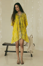 Front view of relaxed yellow mini kaftan with Bali tie-dye patten - Tulalara